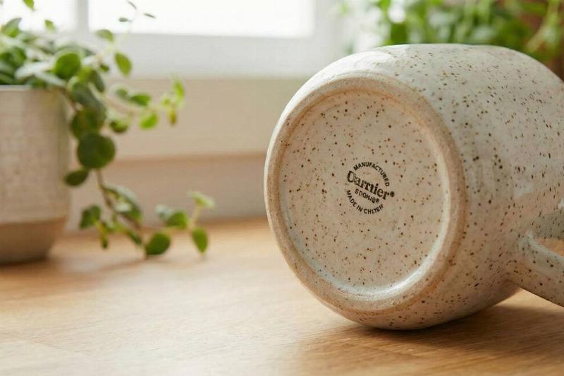 The bottom of a mug with no sticker.