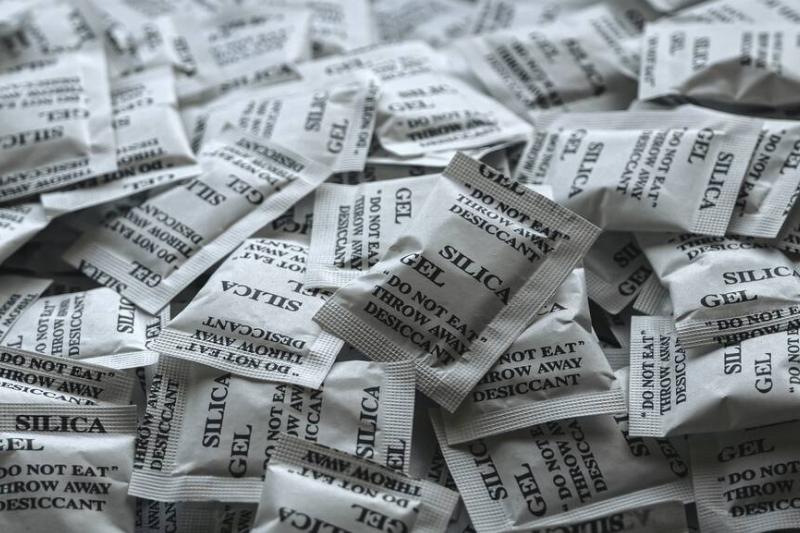 A bunch of silica gel packets. 