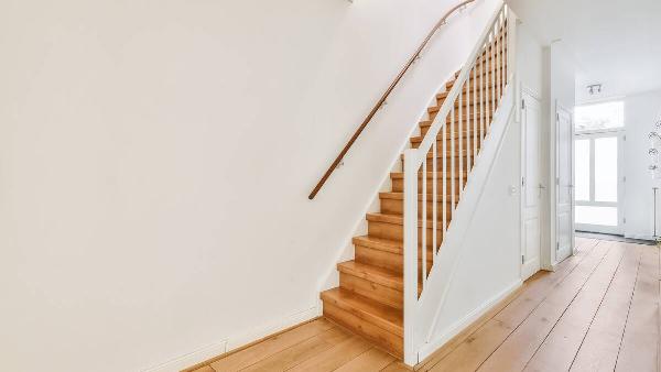 A staircase with railings in a house. 