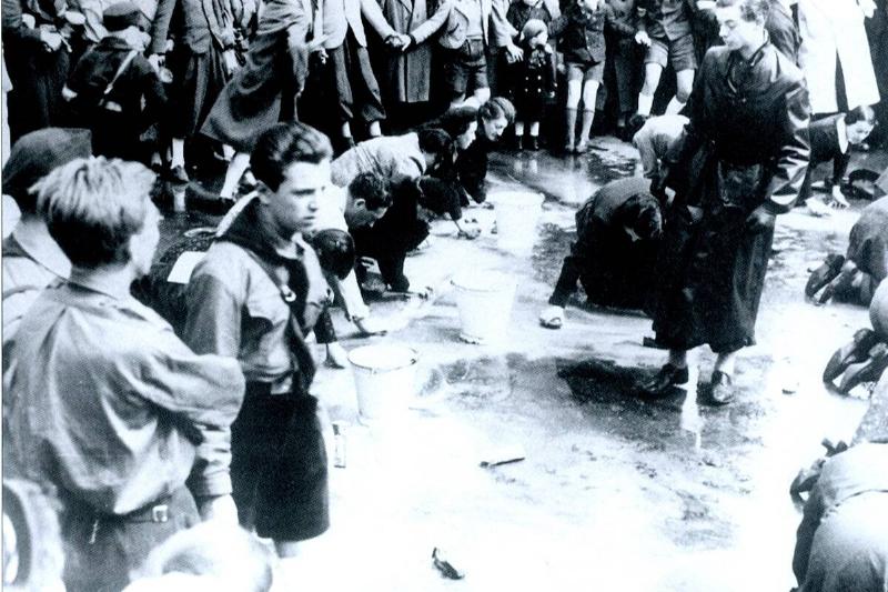 Austrian Jews forced to wash a street in Vienna following the German Anschluss (Annexation) of Austria in 1938...