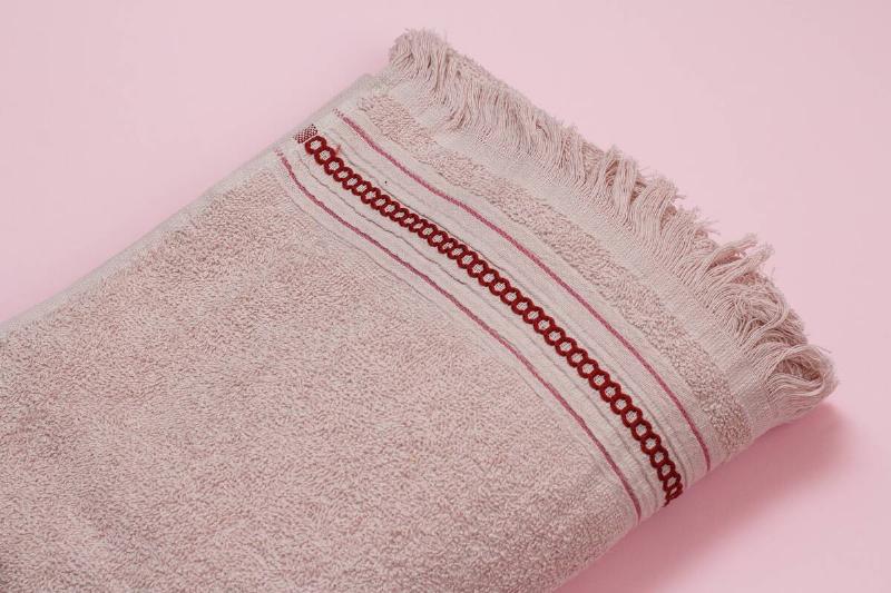 A flat, decorative band on a towel.