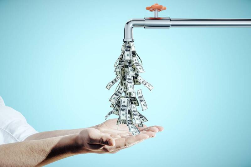 A faucet pouring money into someone's hand. 