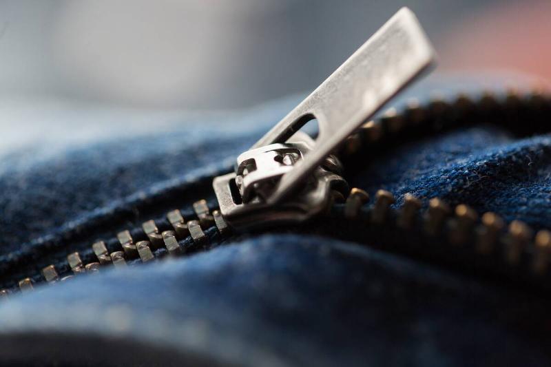 Zipper on denim jeans. 