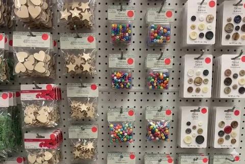 Red dot stickers on craft supplies at Dollar Tree. 