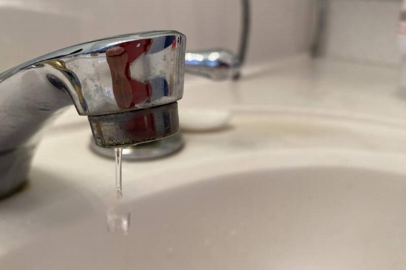 A faucet dripping water. 