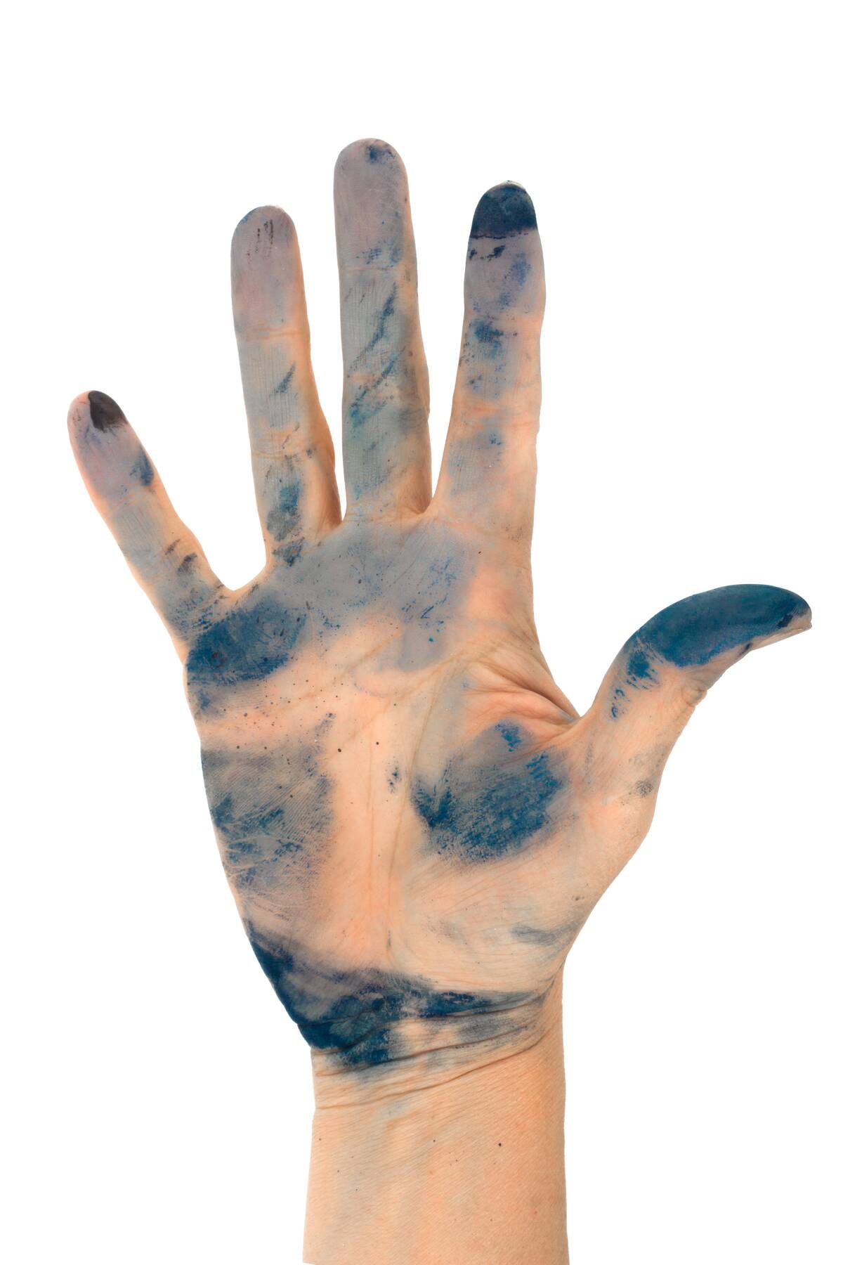 Hand covered in ink smudges. 