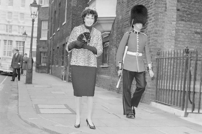 Jacqueline Susann Carrying a Stuffed Poodle
