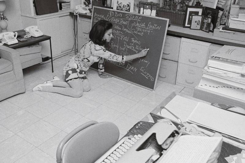 Jacqueline Susann Writing on a Blackboard