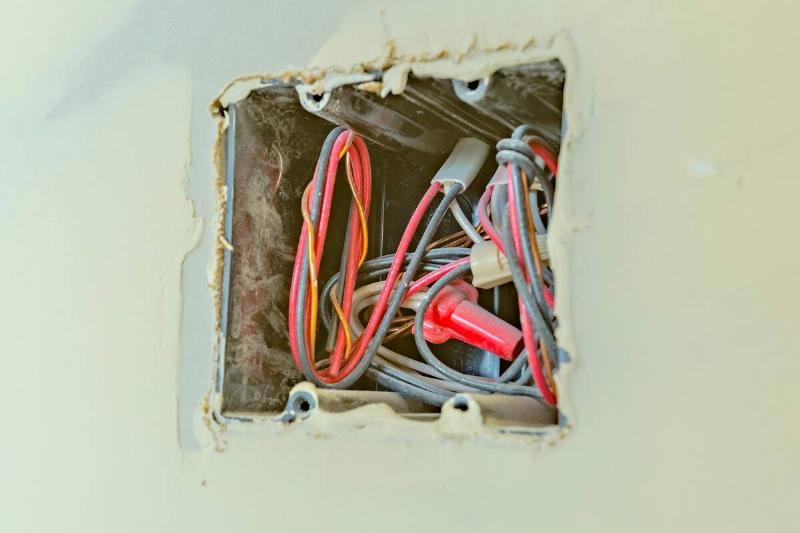 Wires inside of light switch box.