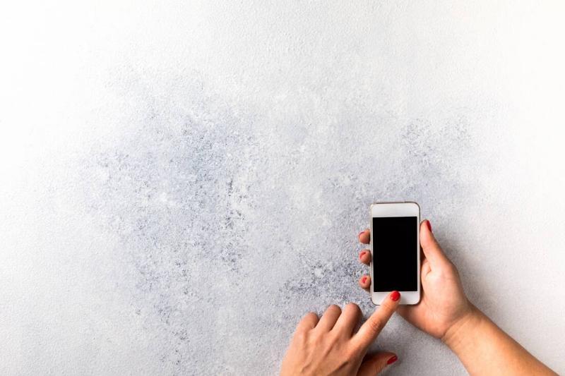 Phone in front of a wall. 