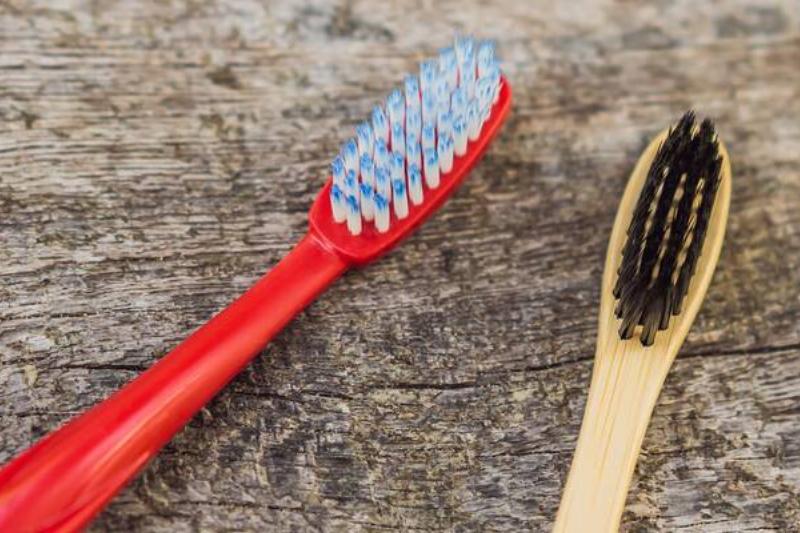 Two toothbrushes on stone. 