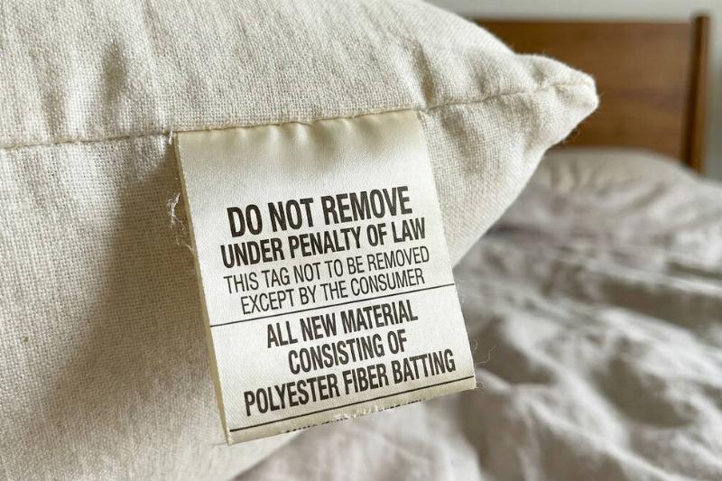 'Do not remove' tag on pillow. 