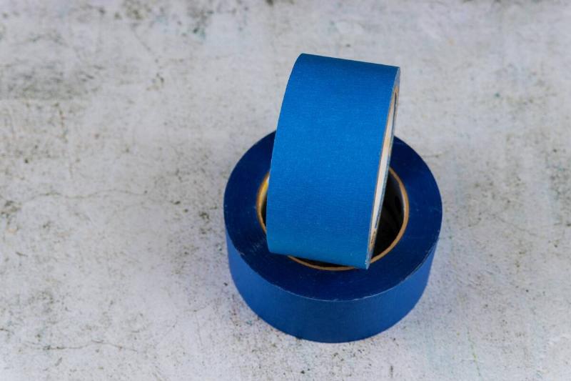 Two rolls of blue painter's tape. 