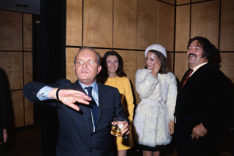 Truman Capote Raising His Arm