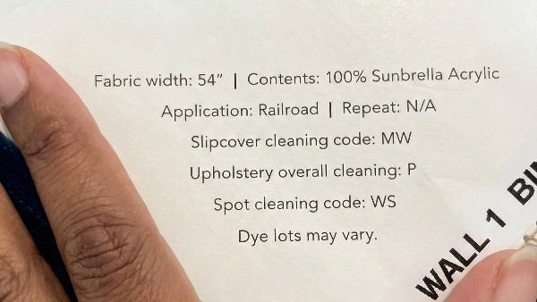 Upholstery cleaning tag on a couch. 