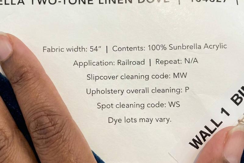 Upholstery cleaning tag on a couch. 