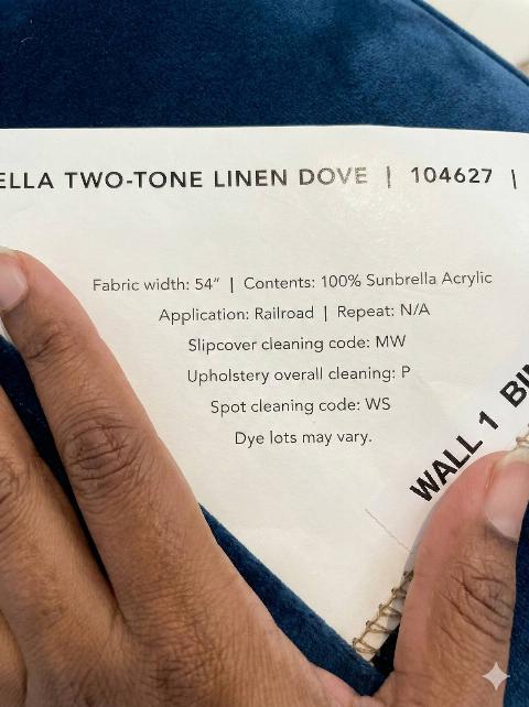 Upholstery cleaning tag on a couch. 