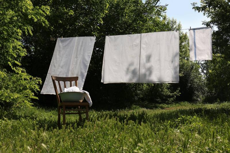 Sheets drying on a line outside. 