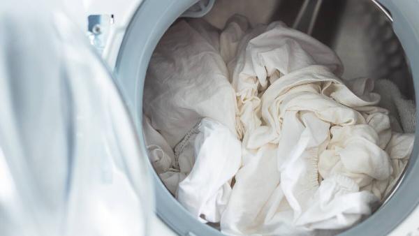 White sheets in washing machine. 