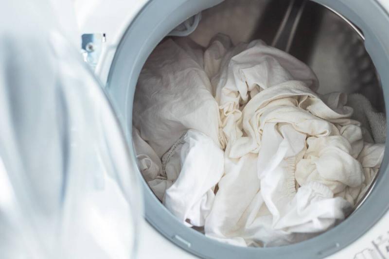 White sheets in washing machine. 