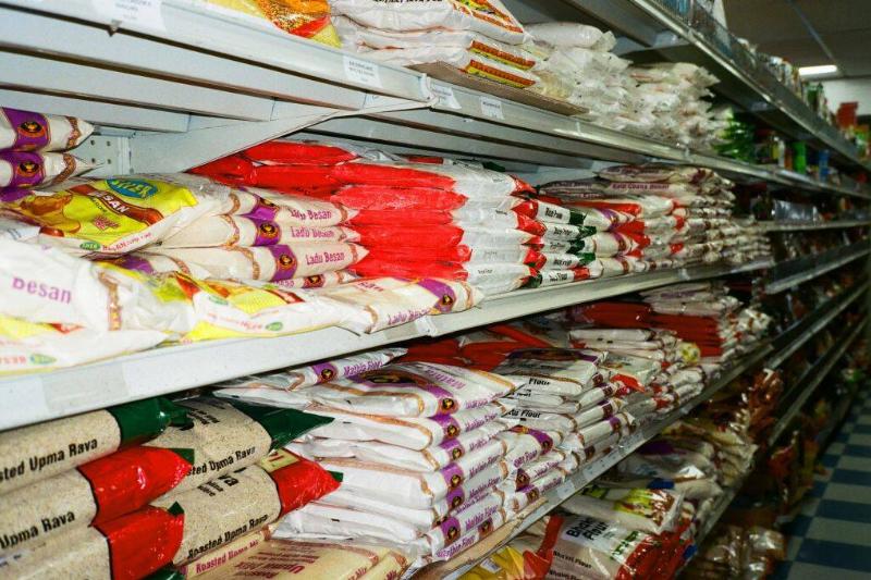 Shelves of rice in a grocery store