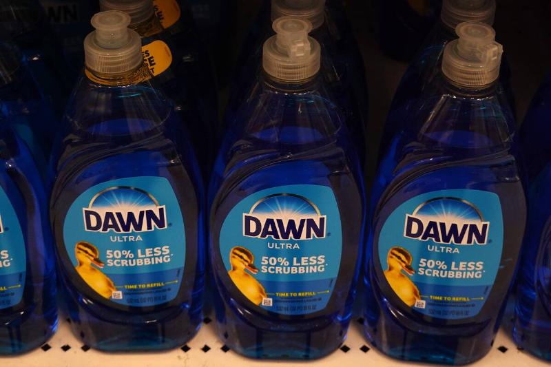 Bottles of blue Dawn dish soap on a store shelf.