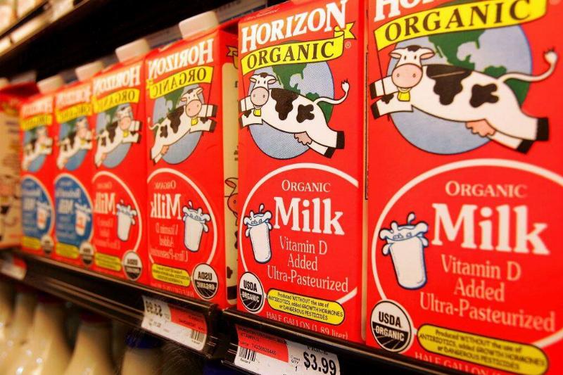 Cartons of Horizon Organic milk in a grocery store freezer