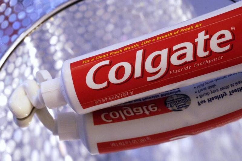 A tube of white, Colgate toothpaste. 