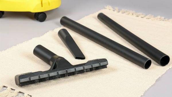 Different vacuuming attachments laid out flat. 