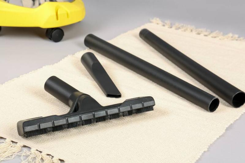 Different vacuuming attachments laid out flat. 