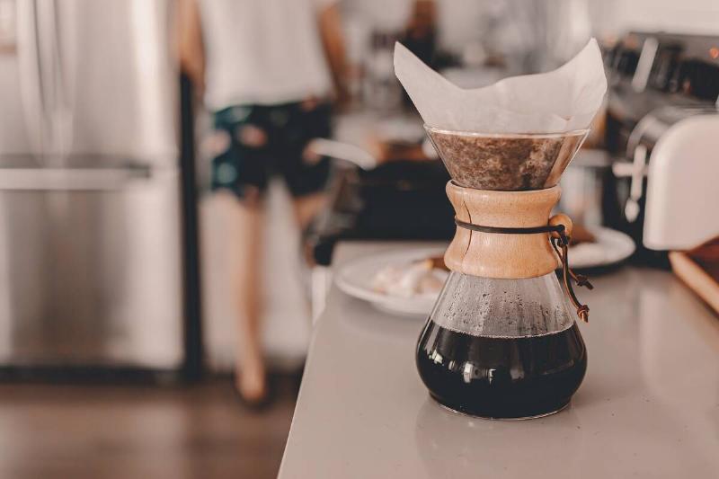 A pour over coffee maker on a counter. 