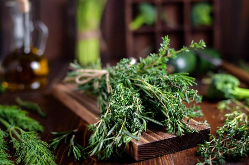 Bundle of herbs on a wooden cutting board