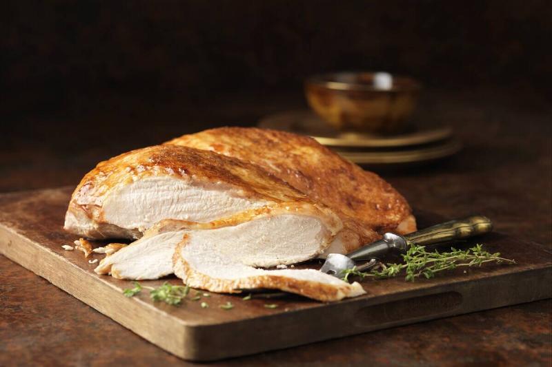 Cooked turkey on a wooden cutting board