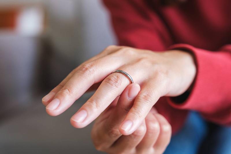 Woman touching a silver ring around her finger
