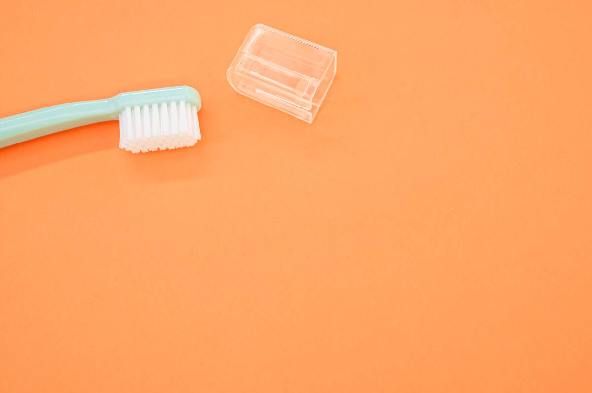 A plastic cap and a toothbrush. 