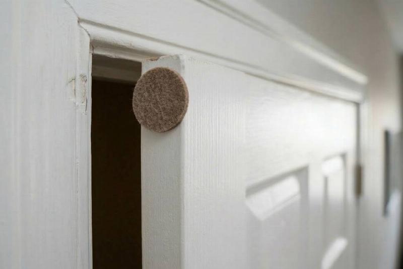 A felt pad on the edge of a door. 