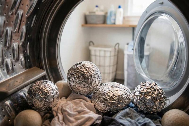 Balls of aluminum foil in a dryer. 