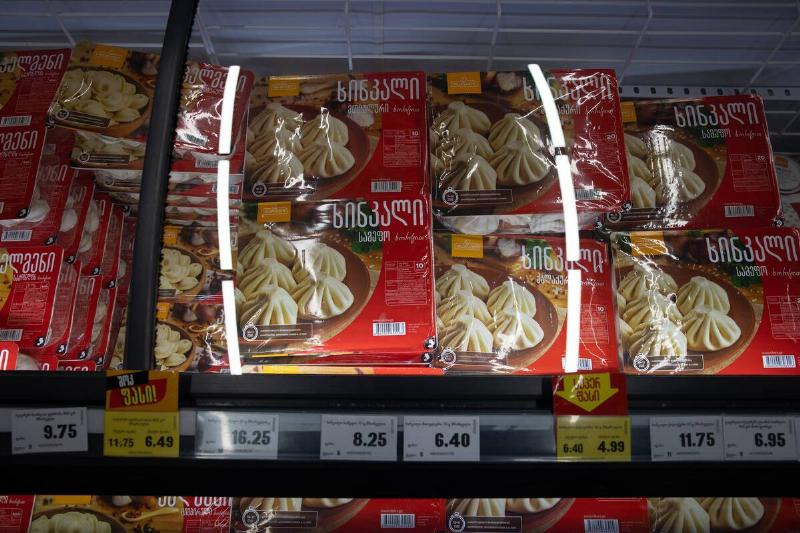 Store freezer filled with boxes of frozen dumplings