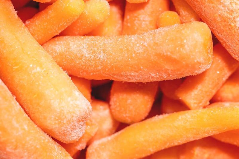 Pile of frozen baby carrots