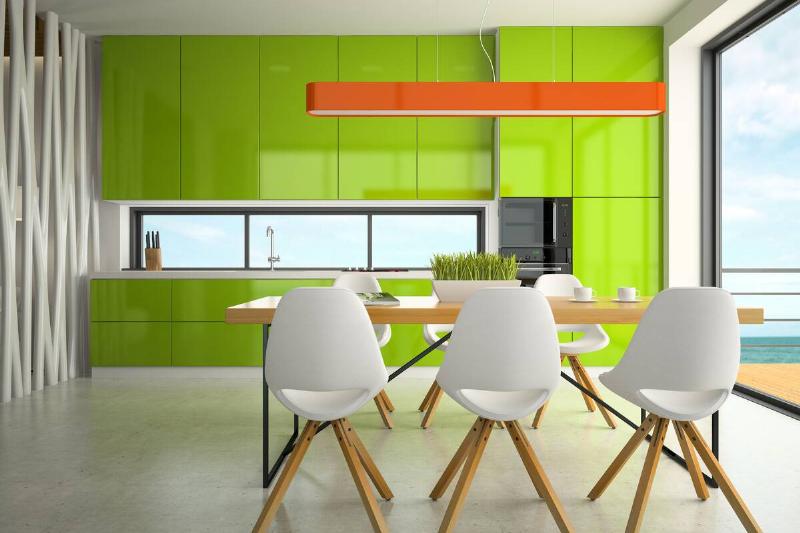 A kitchen with bright green cabinets. 