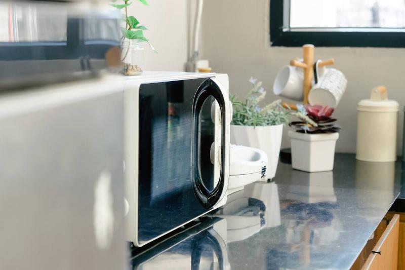Microwave on kitchen counter. 
