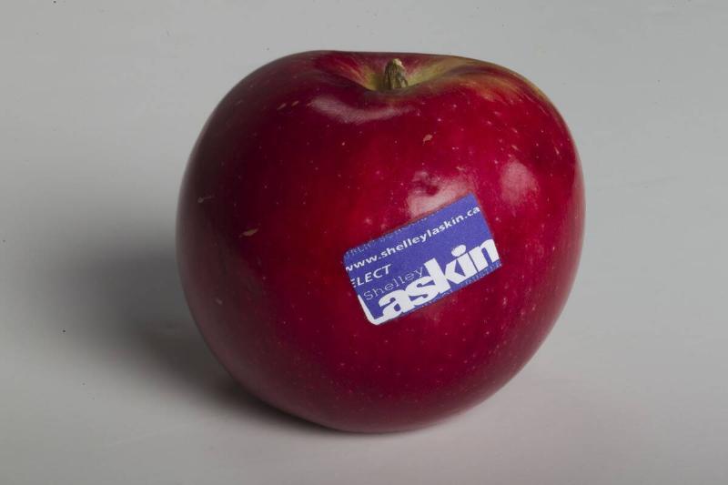 Red apple with a sticker on it
