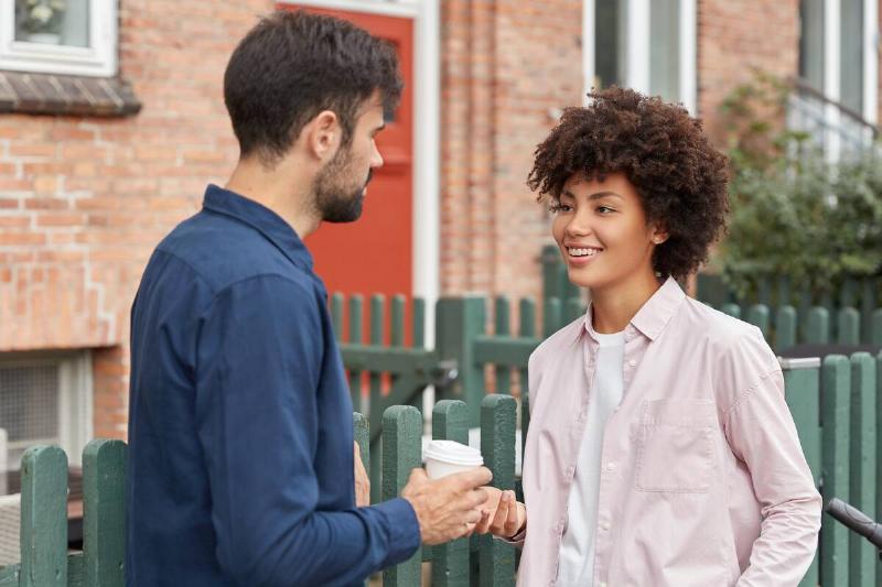 Man and woman talking on the street. 