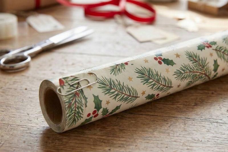 A paper clip holding wrapping paper together. 