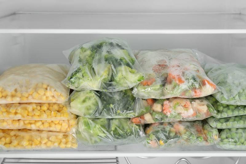Bags of vegetables in a freezer