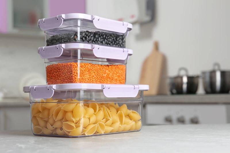 Plastic containers holding different pantry staples. 