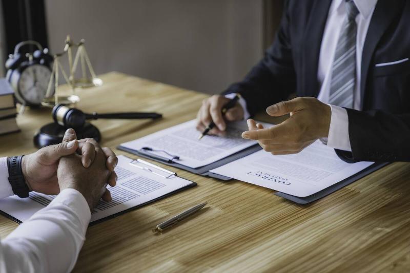 Two lawyers talking to each other. 