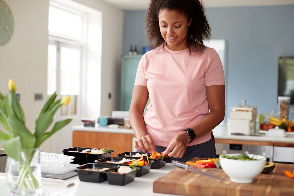 Woman preparing food at her kitchen counter