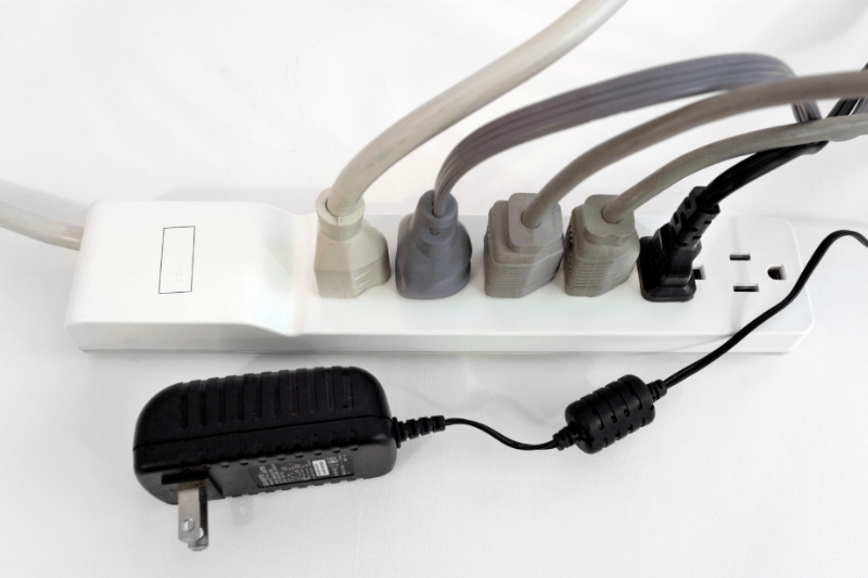 Plugs plugged into a power strip.