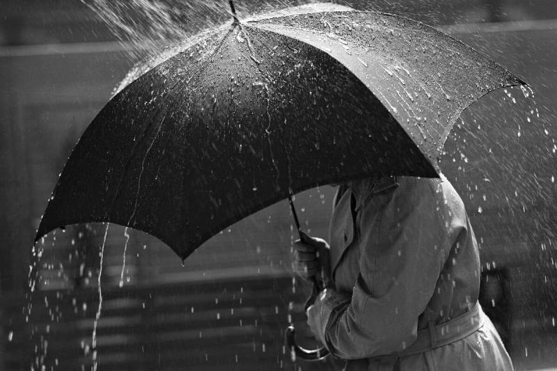Man Walking Under Umbrella/Rainstorm